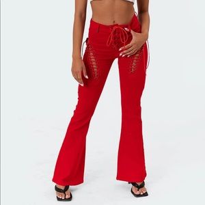Red denim flare pants with ties